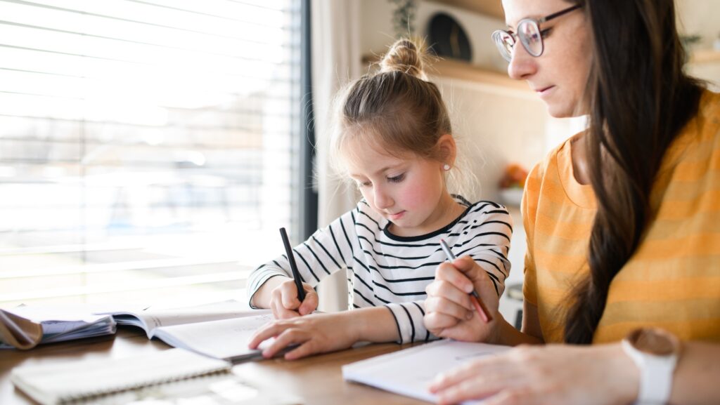 Mother and daughter learning indoors at home